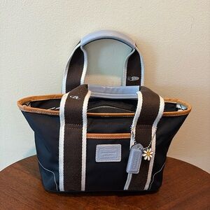 Coach Hampton  mini tote  navy canvas/ tan & Lt blue leather trim
Vinyl interior